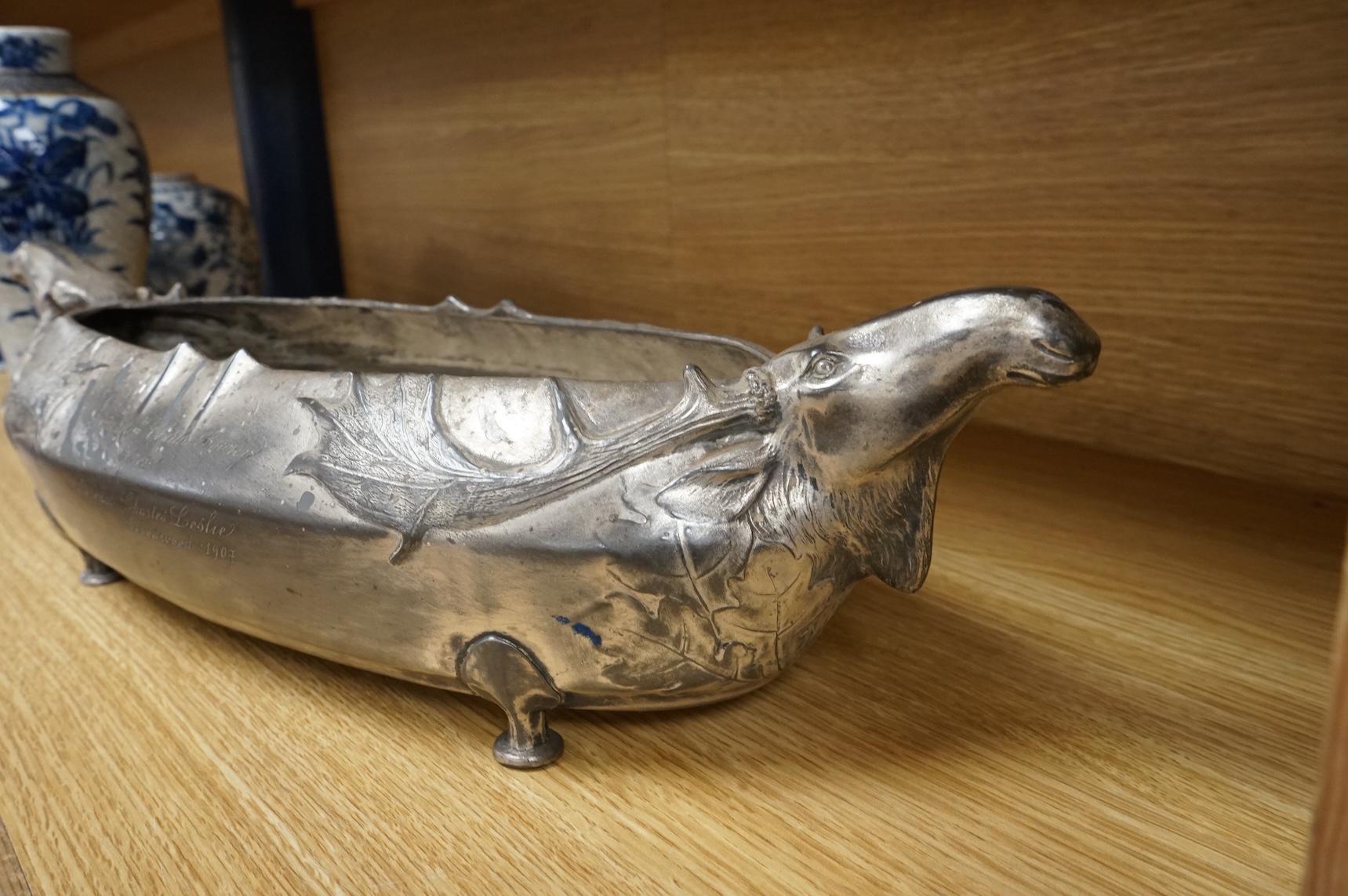 A Kayserzinn Versilbert ‘moose’ centrepiece with presentation inscription dated 1907, 47cm wide